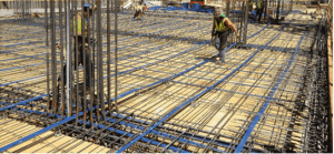 One-way slab and beam floor system. Slab tendons placed parallel with the slab span